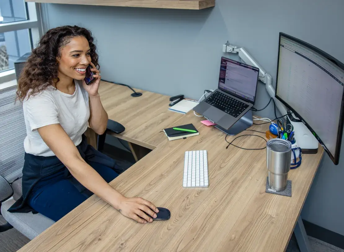 A Shipfusion account manager taking a customer call at her desk